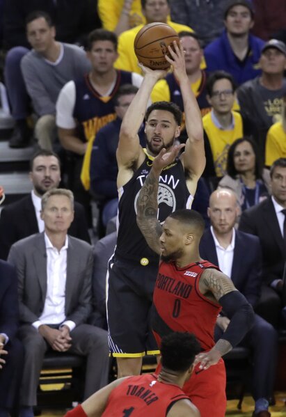 Warriors rally from 15 down at halftime hold off Blazers AP News